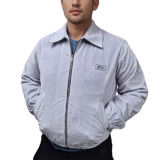 A male model wearing a No limit London sky blue bomber jacket with a full zip, side pockets, and elasticated cuffs. The jacket features a No Limit London brand label on the chest.