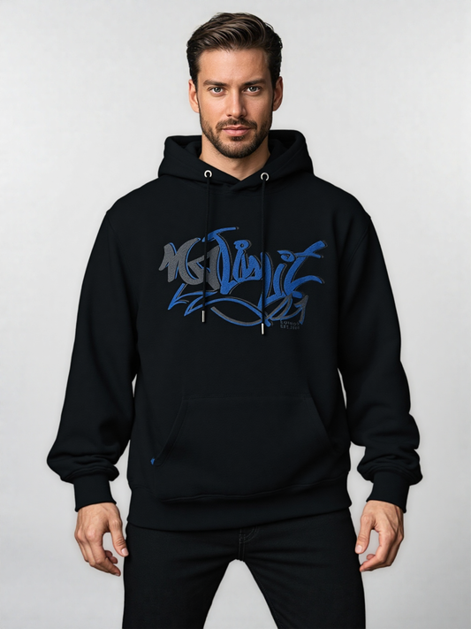 Man wearing a black hoodie with blue graphic design on a light gray background
